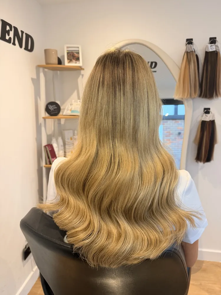 After: fuller golden-blonde waves with extensions