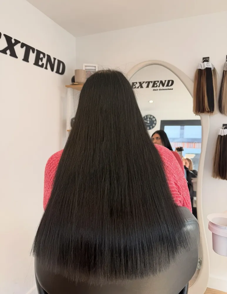 After: long, sleek black hair with extensions