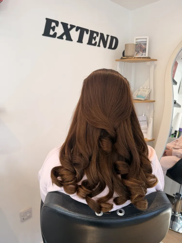 Rich brunette extensions with bouncy curls