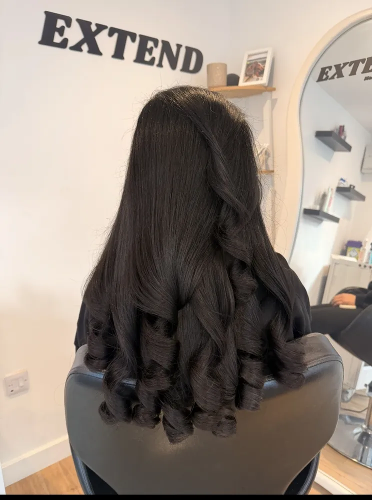 Long black hair with glossy curled ends
