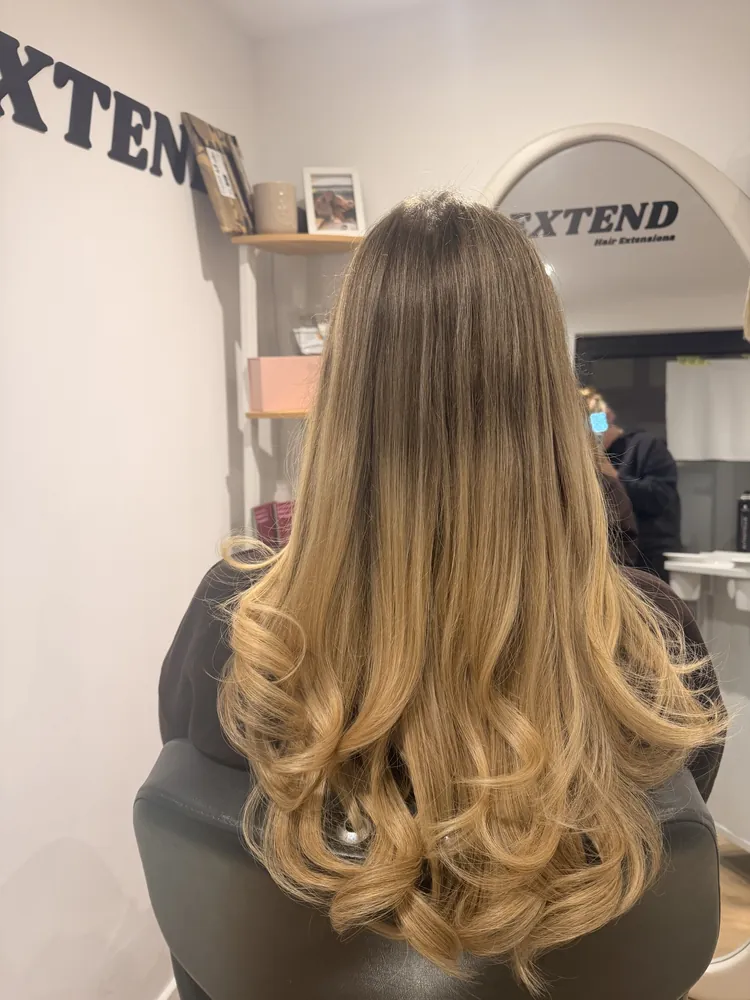 Balayage extensions in soft curls