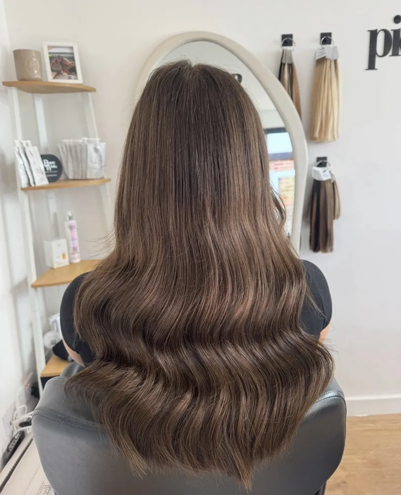 Long brunette waves after a fitting